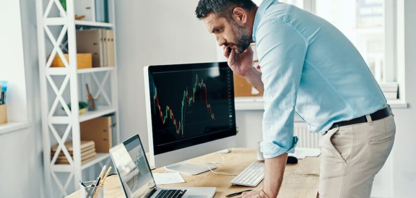 Man looking at retirement options deciding between a 401k or Roth IRA.