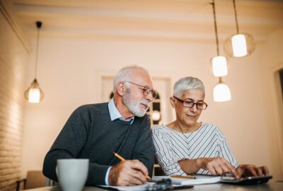 Senior couple reviewing their finances together.