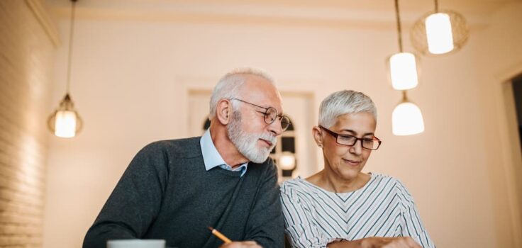 Senior couple reviewing their finances together.