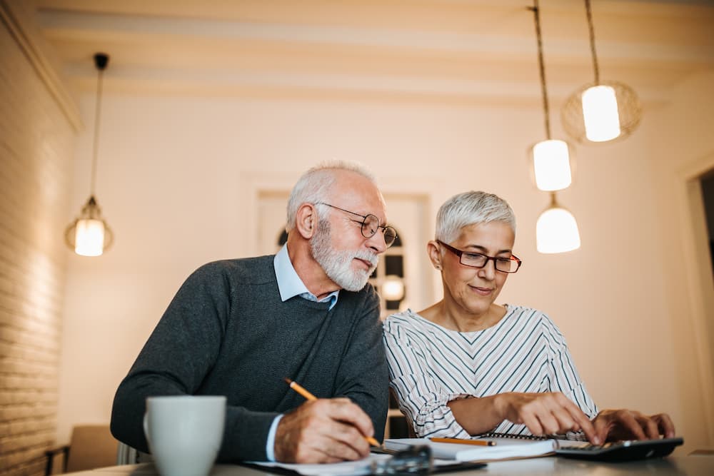 Senior couple reviewing their finances together.